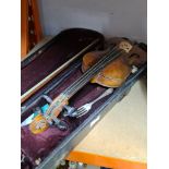 An antique violin in hard wooden case case, the back 14 inches.
