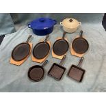 A Le Creuset cast iron tureen & cover; another large oval cast iron enamelled pot & cover; a set