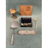 A Georgian hallmarked silver-gilt picture back teaspoon with rococo scrolled bowl and cupid