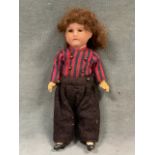 An Armand Marseille bisque headed doll with glass eyes, jointed composition body and limbs, original