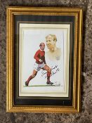 An autographed coloured print portrait of Bobby Charlton in England strip, mounted and gilt framed -