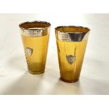 A pair of Victorian horn beakers, with hallmarked silver rims having inscriptions and heraldic