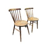 A pair of Ibex spindleback kitchen chairs with circular seats on turned legs & stretchers. (2)