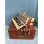 A boxed 50s Hohner Supremus three-octave accordion with chromed lattice grille, pearl bakelite