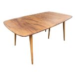 An Ercol elm & beech Grand Windsor pattern extending dining table, the rounded rectangular top
