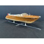 A hand-built hardwood model of an Italian Riva Aquarama speedboat with chromed fittings and white