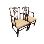 A pair of Georgian mahogany Chippendale style armchairs with scrolled acanthus carved backs above