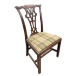 A Georgian mahogany Chippendale style chair with waved carved back rail above pierced splat and