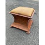 A Victorian mahogany ottoman stool, the hinged square upholstered seat above a waisted compartment