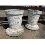A pair of painted composition stone garden urns with tapering faux stonework bucket shaped pots on
