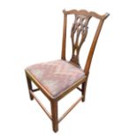 A Chippendale style mahogany chair with pierced splat and waved back rail, having drop-in