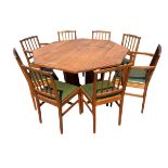 An Alan ‘acornman’ Grainger octagonal arts & crafts style dining table & chair set, the table on