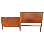 An Edwardian chequer strung mahogany double headboard and bowfronted footboard with moulded cornices