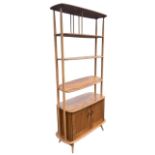 An Ercol elm and beech Giraffe room divider, the rounded rectangular top above a fixed shelf and two