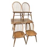 Ercol dining table and four stick back chairs.