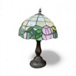 Tiffany style lamp with leaded stained glass shade.