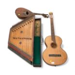 Antique hammered dulcimer in case, guitar and a mandolin