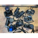 Group of cameras and accessories, including a Pentax P30t and lens, Pentax Spotmatic, Canon F-1, etc