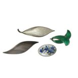 Four Norwegian silver brooches to include David Andersen white enamel leaf brooch and oval enamel fo