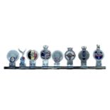 Group of eight assorted military related car grill badges, mounted on a badge bar, to include RAF, R