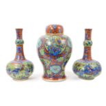 Garniture of 18th century Chinese clobbered porcelain vases