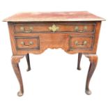 Mid 18th century oak and crossbanded three drawer lowboy