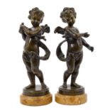 Pair of 19th century continental bronze cupid figures with marble bases