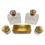 Set of five Victorian silver gilt topped glass dressing table items