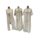 Victorian and Edwardian era lady's underwear including two open leg combinations with lace and ribbo