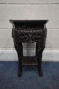A SMALL CHINESE HUANGHUALI OCTAGONAL TABLE, with a marble insert, and intricate carved details all