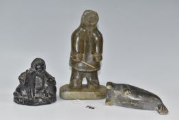 THREE CANADIAN/INUIT STONE SCULPTURES, comprising a figure wearing a hooded coat and holding a small