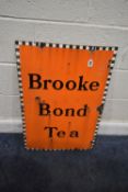 A BROOKE BOND TEAK ENAMEL ADVERTISING SIGN, with a checkered border, width 52cm x height 77cm,
