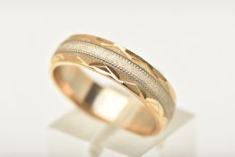 A 9CT GOLD BI-COLOUR WIDE BAND RING, designed as a white and yellow gold textured band,