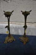 A PAIR OF SMALL BRASS CANDLE STICKS, in the form of a nest in a tree, a bird to the side, raised