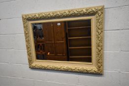 A CREAM AND GILT RECTANGULAR BEVELLED EDGE WALL MIRROR, 100cm x 75cm, condition report: general