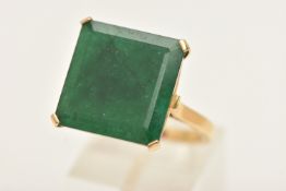 AN 18CT GOLD EMERALD RING, set with a large square cut emerald in a four claw setting, measuring