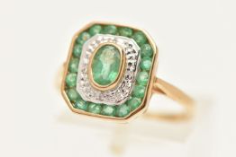 A 9CT GOLD EMERALD AND DIAMOND CLUSTER RING, of a rectangular form, set with a central oval cut