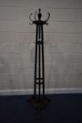 A STAINED OAK CIRCULAR HALL STAND, with brass hooks, height 188cm, condition report: scuff and