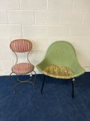 A GILT WROUGHT IRON CHAIR, with an oval backrest and circular seat, with stripped upholstery,