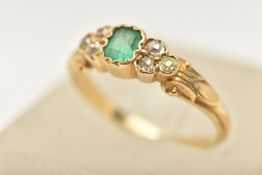 A LATE 19TH TO EARLY 20TH CENTURY, YELLOW METAL EMERALD AND DIAMOND RING, set with a central emerald