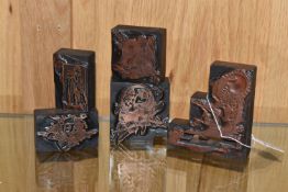 FIVE PRINTING BLOCKS, comprising an image of Father Christmas with a goose, above vacant scrolls for