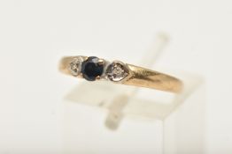 A 9CT GOLD SAPPHIRE AND DIAMOND THREE STONE RING, set with a central sapphire and single cut diamond