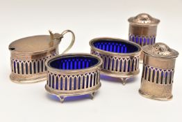 A GEORGE V SILVER CRUET SET, to include two pepperettes, two salts and a mustard, all with blue