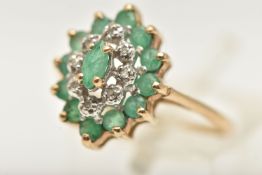 A 9CT GOLD EMERALD AND DIAMOND CLUSTER RING, tiered cluster of a lozenge form, set with a central