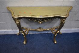 A GILT WOOD SERPENTINE CONSOLE TABLE, with a glass insert, raised on scrolled legs, width 117cm x