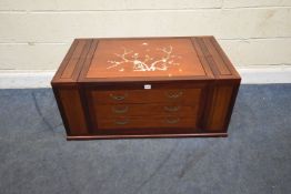 A MODERN HARDWOOD ORIENTAL STYLE LOW WINE CABINET, with mother of pearl inlay to the top, two hinged