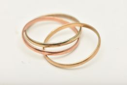 A 9CT GOLD TRI-COLOUR TRILOGY RING, designed as three interlinked plain polished bands, hallmarked