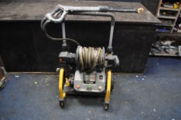 A RYOBI HYDROSURGE ELECTRIC PRESSURE WASHER with soap container (PAT pass and working)