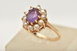 A 9CT GOLD AMETHYST AND PEARL CLUSTER RING, of an oval form, set with a central oval cut amethyst,