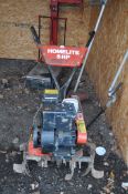 A HOMELITE 5 HP PETROL TILLER/ ROTAVATOR (ENGINE SEIZED)